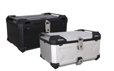 Two robust motorcycle storage boxes, one black and one silver, with secure latches.